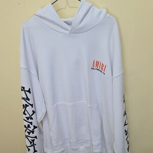 AMIRI White Hoodie with Black Graphics and Orange Logo